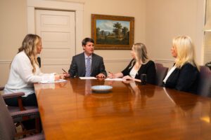 the team of met lane law discussing legal case in conference room