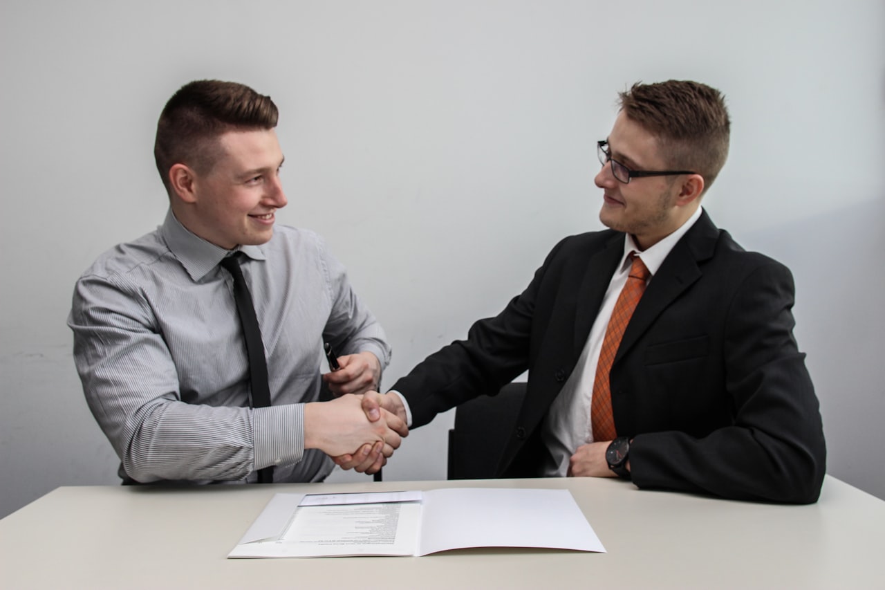A business handshake after resolving a contract dispute