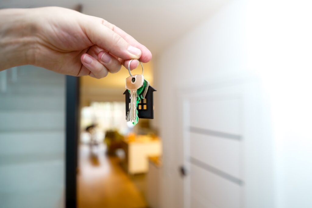 Holding house keys representing inherited property