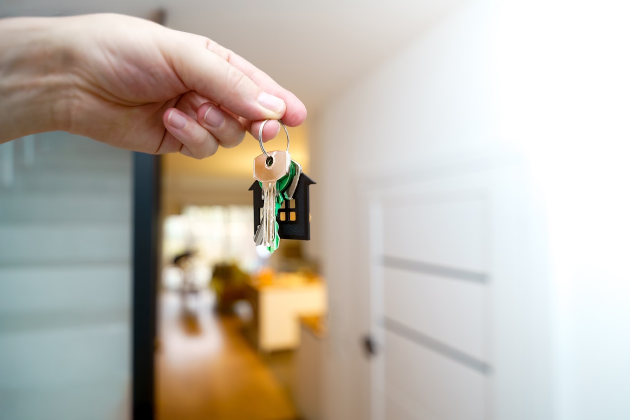 Holding house keys representing inherited property